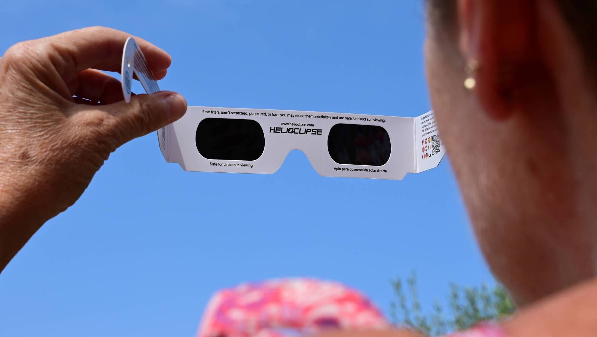 Underprepared, without as much as a colander or a cornflake box in my bag, I offer a passing child some crisps in exchange for a moment with his eclipse glasses. File picture: Romain Doucelin / Hans Lucas. 