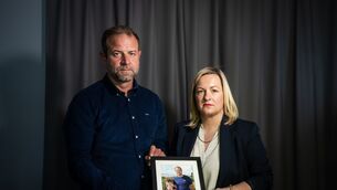 <p>Craig Coady holds a photograph of himself and his late son Rory as Deirdre O’Shaughnessy listens during the recording of an Irish Examiner podcast. Picture: Chani Anderson</p>