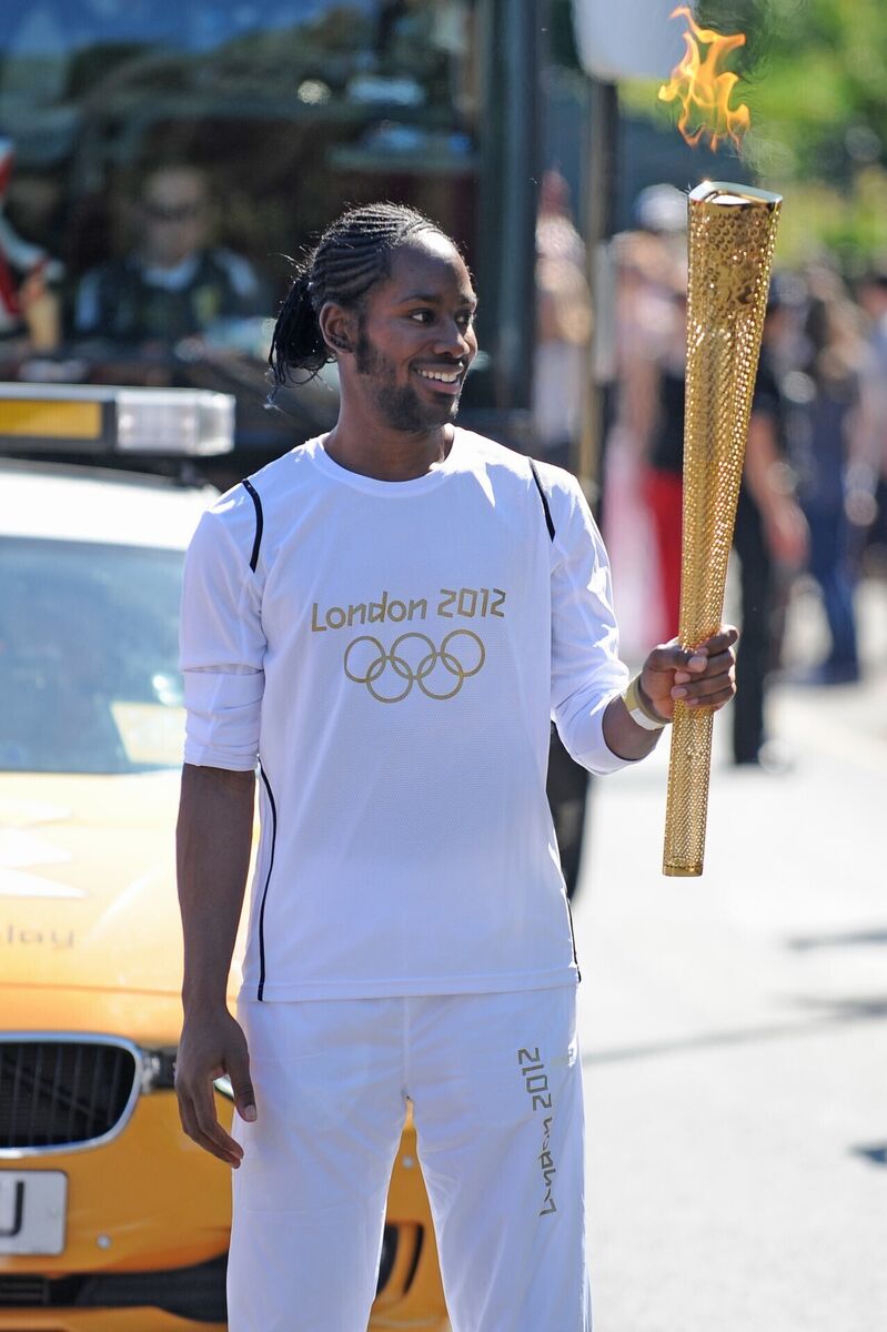 Torchbearer 132 Jason Arday carries the Olympic Flame on the Torch Relay leg between Sutton and Merton in London in 2012. Picture: Joe Giddens/LOCOG/PA Wire Torchbearer 132 Jason Arday carries the Olympic Flame on the Torch Relay leg between Sutton and Merton in London in 2012. Picture: Joe Giddens/LOCOG/PA Wire