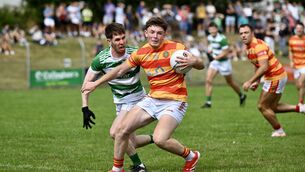 <p> Daire McAree holds possession for Newcestown in the McCarthy Insurance Group Premier Senior Football championship: Valley Rovers vs Newcestown. Picture: Larry Cummins</p>