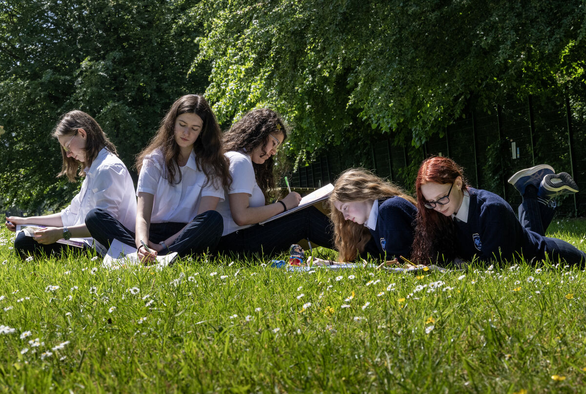  Presentation Secondary School Tralee students Emily O'Connor, Emily O'Regan, Ranya Alreesae, Isabel Cox, and Natasha Zcyb studying in the sunshine on May 25 during one of the summer's first spells of warm weather. A member of the public in the town complained during the first heatwave about a 10C disparity in Met Éireann's reports. Picture: Domnick Walsh