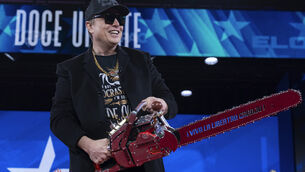 <p>Elon Musk brandishing a chainsaw to celebrate his 'DOGE' budget cuts at a February 2025 conference in Maryland. File picture: José Luis Magana/AP</p> <p>Elon Musk brandishing a chainsaw to celebrate his 'DOGE' budget cuts at a February 2025 conference in Maryland. File picture: José Luis Magana/AP</p>