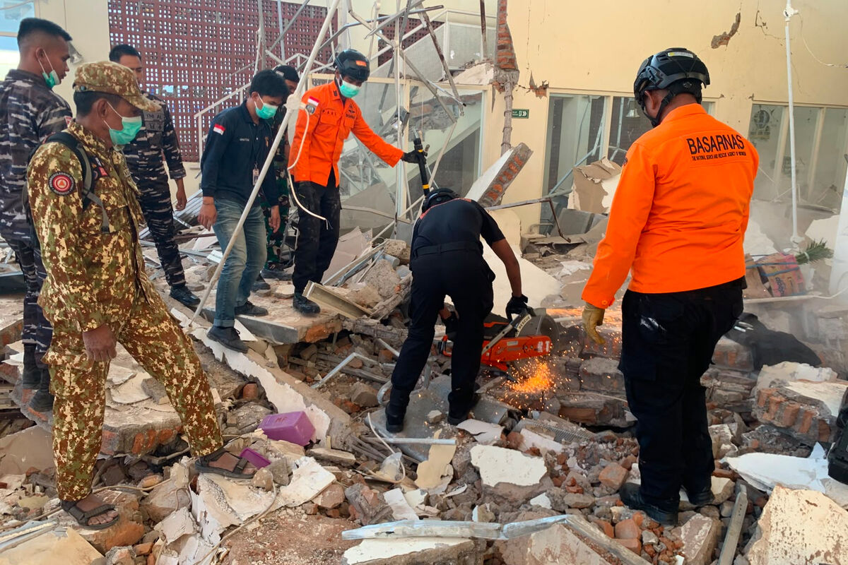 Rescuers attempting to clear debris at a building damaged by the earthquake in Maumere, East Nusa Tenggara Province, Indonesia. Picture: Indonesian National Search and Rescue Agency/AP Rescuers attempting to clear debris at a building damaged by the earthquake in Maumere, East Nusa Tenggara Province, Indonesia. Picture: Indonesian National Search and Rescue Agency/AP