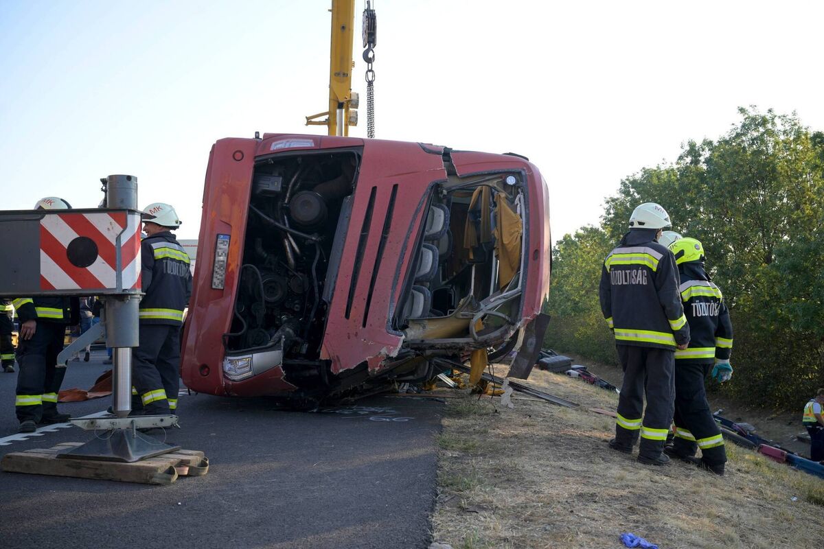 Emergency services at the scene after a bus went off the road between Mezokeresztes and Mezonagymihaly in Hungary. Picture: Zoltan Mathe/MTI/AP7