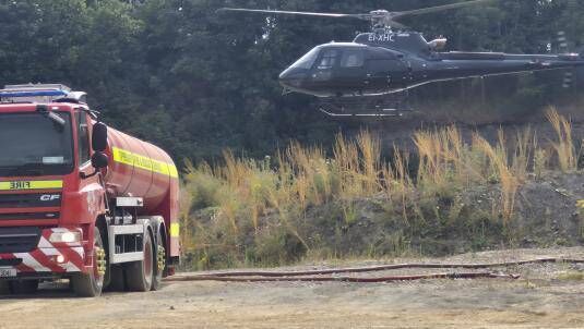 A fire tanker and helicopter at Slievenamon during the wildfire last month. Photo: Tipperary County Council 
