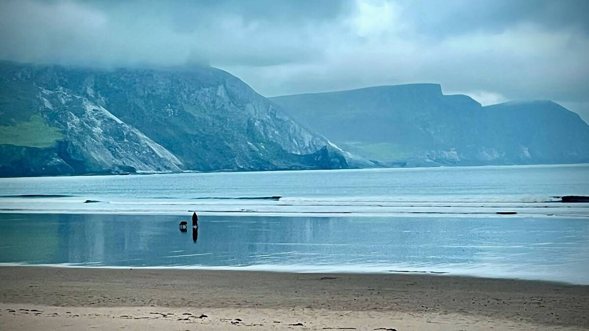 Walking the dog on Keel Beach in Achill. Walking the dog on Keel Beach in Achill.