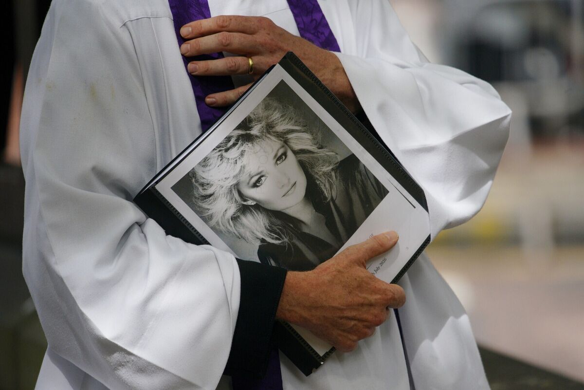 Member of the clergy with a picture of Bonnie Tyler ahead of her funeral. Picture: Ben Birchall/PA Wire Member of the clergy with a picture of Bonnie Tyler ahead of her funeral. Picture: Ben Birchall/PA Wire