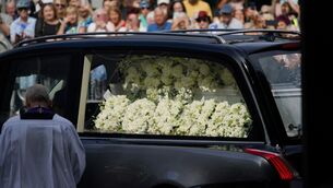 <p>Floral tributes in the hearse carrying the coffin as it arrives for the funeral of Bonnie Tyler at Swansea Minster. Picture: Ben Birchall/PA Wire</p>