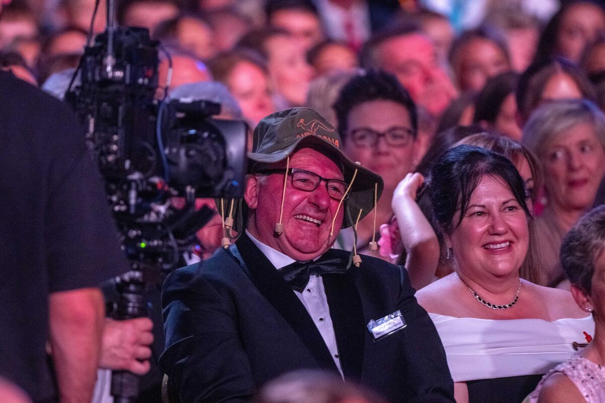 Melbourne Rose Mikaela Whitty's dad Mick Whitty chuckles as James Patrice places an Akubra-style hat on his head during last night's Rose of Tralee event. Melbourne Rose Mikaela Whitty's dad Mick Whitty chuckles as James Patrice places an Akubra-style hat on his head during last night's Rose of Tralee event.