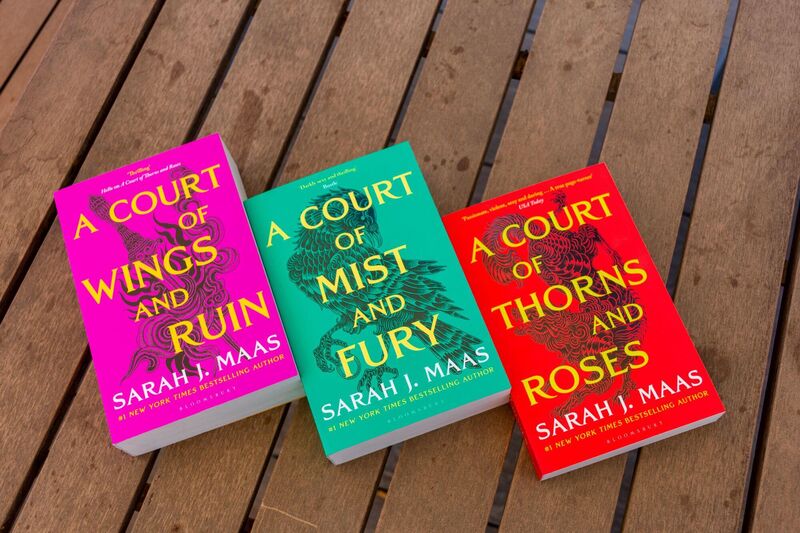 The first three books in Sarah J. Maas's A Court of Thorns and Roses fantasy series.