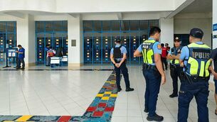 <p>Philippine police gather at the scene of the school shooting in Zamboanga in the southern Philippines. Picture: Roel Parreno / AFP via Getty Images).</p>