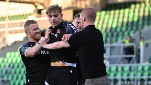 <p>A supporter from the South Stand runs onto the pitch to interrupt the Dundalk celebrations. Pic: Stephen McCarthy/Sportsfile.</p> <p>A supporter from the South Stand runs onto the pitch to interrupt the Dundalk celebrations. Pic: Stephen McCarthy/Sportsfile.</p>