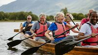 Seniors Enjoying And Having Fun In Rowing Boat