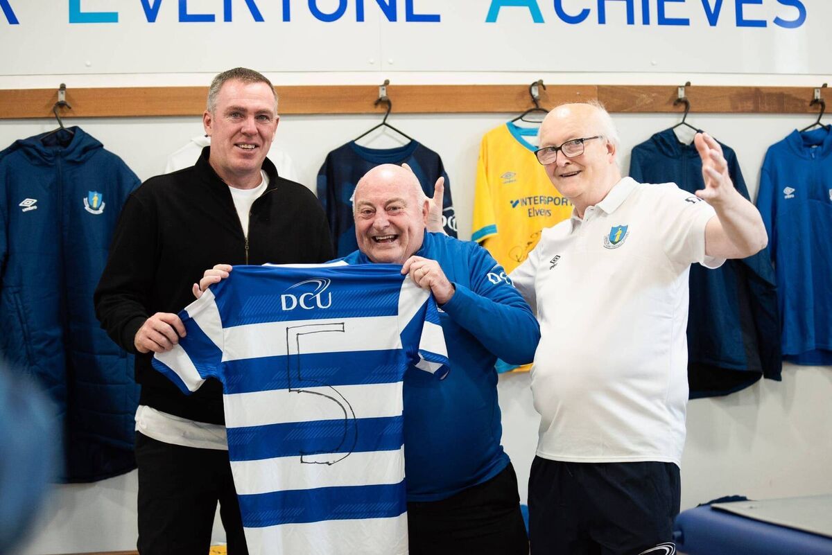 Richard Dunne with former Ireland kitman Dick Redmond, Home Farm DCU Equipment Manager Pat Hoban and the number five Home Farm DCU jersey
