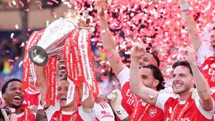 <p>Arsenal's Martin Odegaard lifts the Premier League trophy. Pic: John Walton/PA Wire.</p>