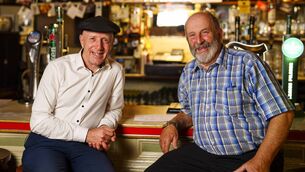 <p>TDs Michael and Danny Healy Rae pictured at the Healy Rae Bar, owned by Danny, during Michael's term as a Junior Minister in the Department of Agriculture. Picture: Jerry Kennelly/Local Story Films</p>