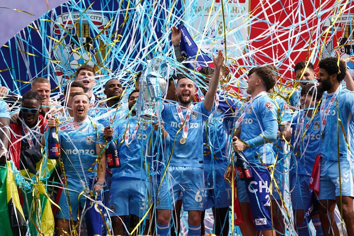 Coventry City's captain Matt Grimes lifts the Championship trophy after their defeat of Wrexham last April. Pic: Jacob King/PA Wire