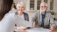Happy old elderly senior grandparents family couple clients signs financial insurance, pension, startup, dealing handshake agent