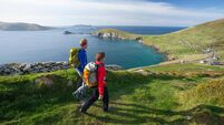Walkers on the Dingle Way above Slea Head, Dingle Peninsula, County Kerry, Ireland.