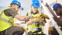 female construction apprentice and colleague