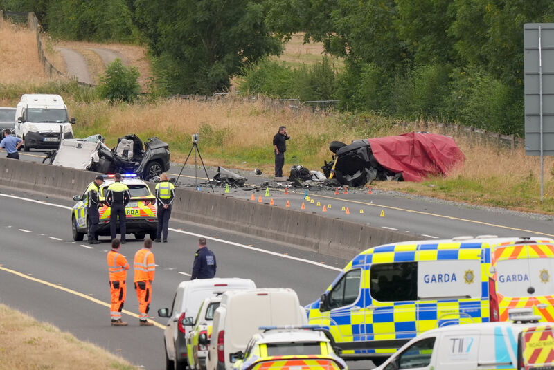 Suitcases by one of the vehicles at the scene on the M9 northbound at Junction 3 in Co Kildare, where a number of people have died and others have been seriously injured after a head-on collision between two cars. Picture: PA