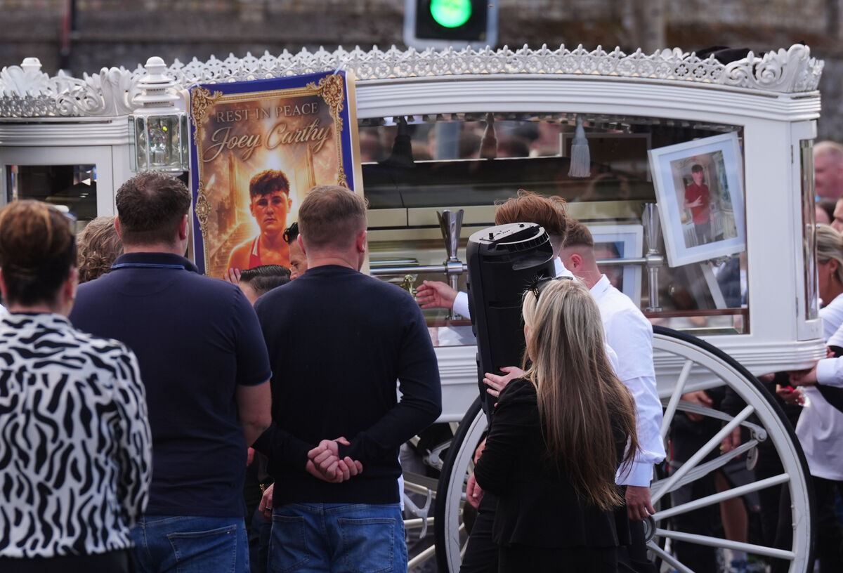 The funeral cortege for Joe Carthy, 15, arrives at St Michael the Archangel Church in Athy (Brian Lawless/PA) The funeral cortege for Joe Carthy, 15, arrives at St Michael the Archangel Church in Athy (Brian Lawless/PA)
