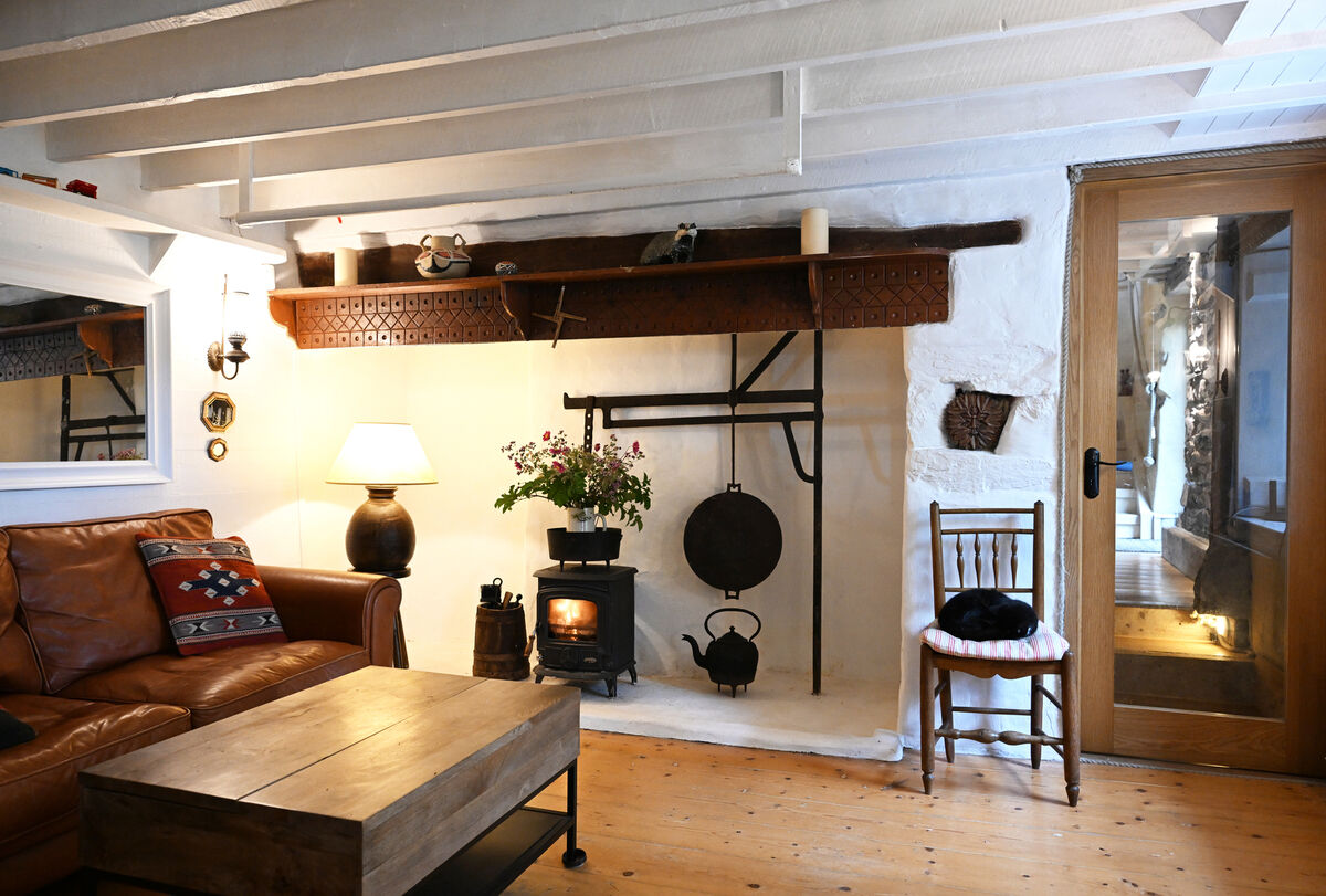 A stove in the traditional style farmhouse fireplace. A stove in the traditional style farmhouse fireplace.