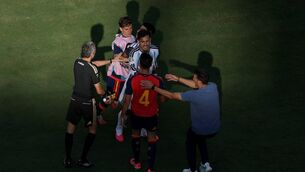 <p>Leandro Paredes of Argentina and Eric Garcia of Spain argue while Lionel Scaloni tries to separate them. Pic: Al Bello/Getty Images</p>