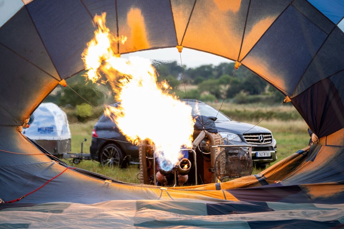 Zack Daly fires up the burners to inflate the Discover Waterford hot air balloon ahead of their flight in the grounds of Waterford Castle. Picture: Chani Anderson Zack Daly fires up the burners to inflate the Discover Waterford hot air balloon ahead of their flight in the grounds of Waterford Castle. Picture: Chani Anderson