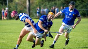 <p>Ballinhassig’s Brian Lynch falls as he is chased by Inniscarra’s David Keane during their Cork SAHC clash. Pic: Chani Anderson</p>