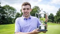 Aaron Ryan celebrates with the trophy 23/8/2026