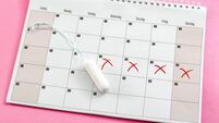 Menstrual cycle, feminine care, menstruation and intimate products concept with internal tampon next to a calendar isolated on p