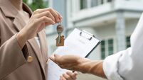 lease, rental and selling home. Real estate agent manager smile holding key for new owner. rent house, Sales, loan credit financ