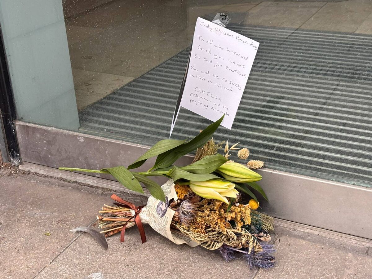 Floral tributes left at the Carlton House apartment complex on Cecil Street in Limerick City. Picture: Manon Gilbart