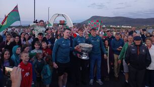 <p>All-Ireland champions Diarmuid O'Connor, Jack Carney, and Donnacha McHugh pictured after carrying Sam Maguire onto Achill Island. </p>