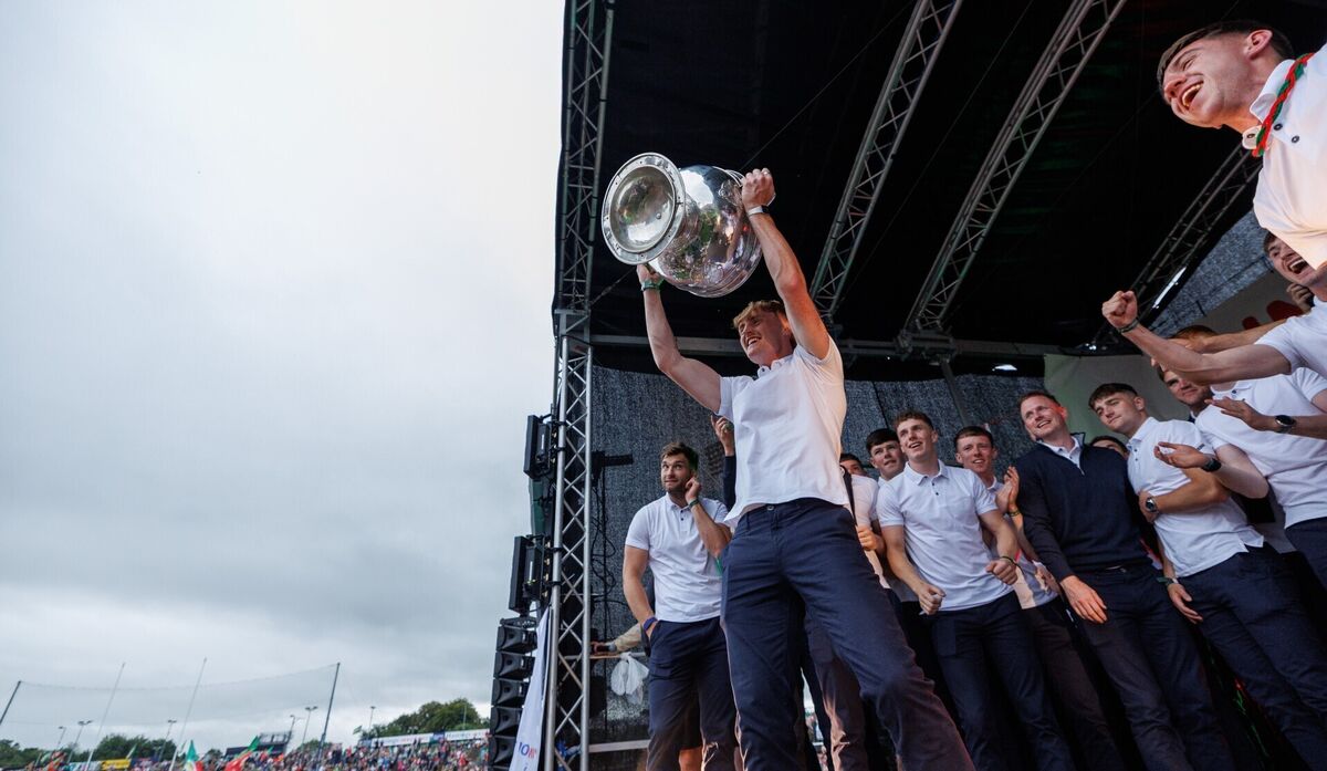 Jack Carney lifts the Sam Maguire Cup at Mayo's homecoming in Castlebar. Picture:INPHO/James Crombie