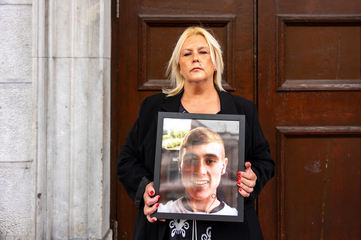 Deirdre Crowley holds a photo of her son Jamie outside Cork Courthouse on day one of the inquest into his death in Cork Prison. Picture: Noel Sweeney