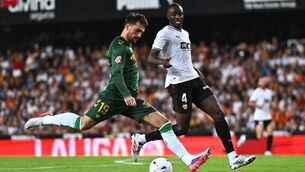 <p>Troy Parrott of Real Betis shoots under pressure from Mouctar Diakhaby of Valencia. Pic: Francisco Macia/Getty Images</p> <p>Troy Parrott of Real Betis shoots under pressure from Mouctar Diakhaby of Valencia. Pic: Francisco Macia/Getty Images</p>