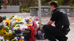 <p>Police officers look at flowers at the Cleveland Police HQ in Middlesbrough (Owen Humphreys/PA)</p> <p>Police officers look at flowers at the Cleveland Police HQ in Middlesbrough (Owen Humphreys/PA)</p>