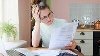Indoor shot of young European Caucasian girl looking at financia