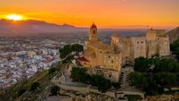 Aerial sunset panorama view of Cullera castle and popular seaside resort vacation town near Valencia Spain