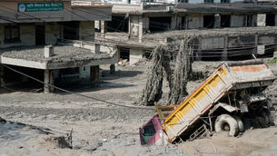 <p>Damaged houses and vehicles are seen in the aftermath of flash floods along the Trishuli River in Nepal's Nuwakot district, Wednesday, Aug. 26, 2026. (AP Photo/Niranjan Shrestha)</p>