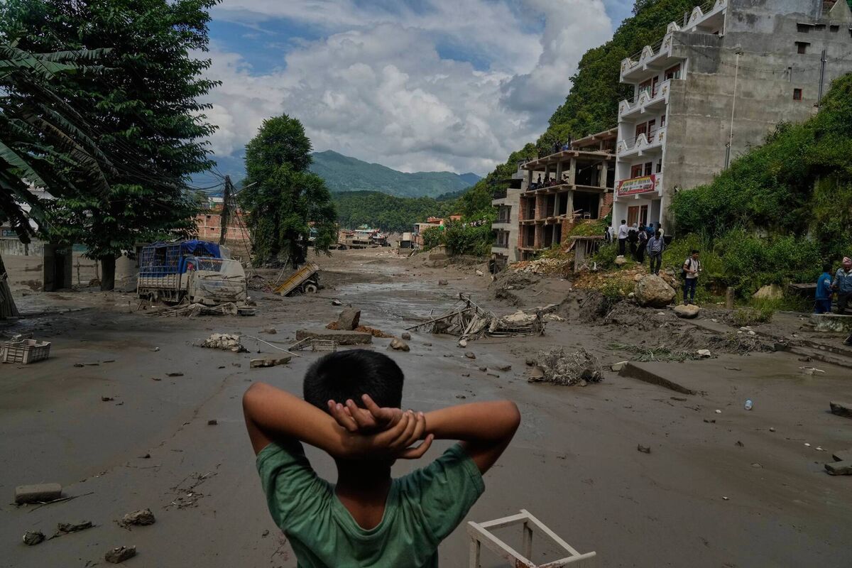 A boy looks at the devastation caused by flash flooding along the Trishuli River in Nepal's Nuwakot district, Wednesday, Aug. 26, 2026. (AP Photo/Niranjan Shrestha) A boy looks at the devastation caused by flash flooding along the Trishuli River in Nepal's Nuwakot district, Wednesday, Aug. 26, 2026. (AP Photo/Niranjan Shrestha)