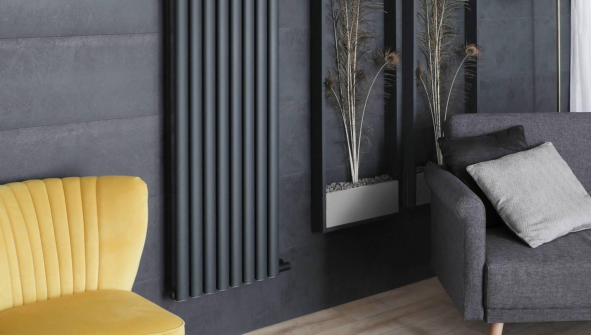 Here a modern radiator is balanced against some artful panelling, visually earning the space. The tonal blue gives it a sense of belonging. Milano Aruba in Graphite from €296, Best Heating.