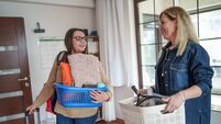 iStock-2209298611.jpg Mother and Daughter Enter New College Dorm Room with Personal Belongings
