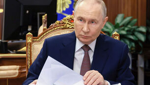 <p>Russian President Vladimir Putin listens to the head of the North Ossetia-Alania Republic of Russia Sergei Menyailo, during their meeting at the Kremlin, in Moscow. (Vyacheslav Prokofyev/Sputnik, Kremlin Pool Photo via AP)</p>