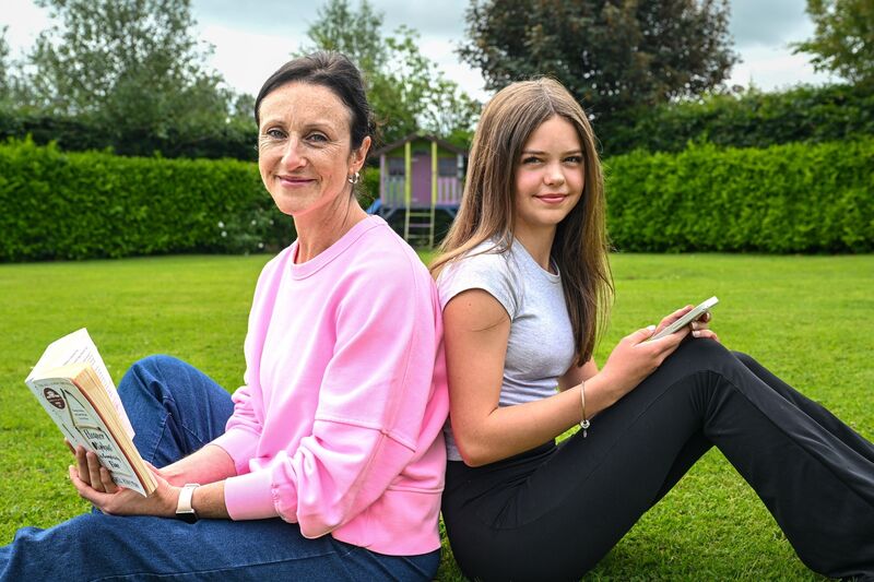 Claire Hartnett and her daughter Bree. Claire wrote a book to encourage her 14-year-old daughter to put down her phone and pick up a book instead. Picture: Chani Anderson Claire Hartnett and her daughter Bree. Claire wrote a book to encourage her 14-year-old daughter to put down her phone and pick up a book instead. Picture: Chani Anderson