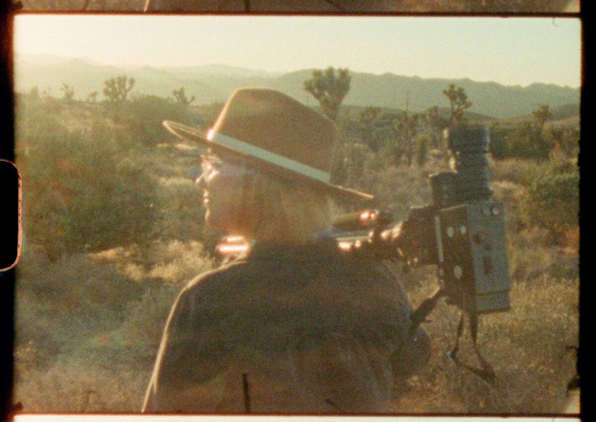 One of the participants in the Super Nature documentary with a Super 8 camera. 