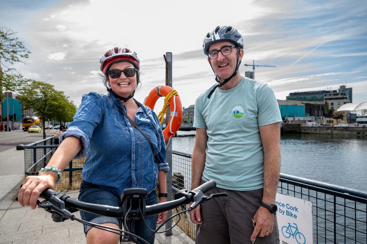 Esther McCarthy and James Foley, founder of Beyond the Glass Adventure Tours, pictured on St Patrick’s Quay before setting off to explore Cork City by bike. Picture: Chani Anderson