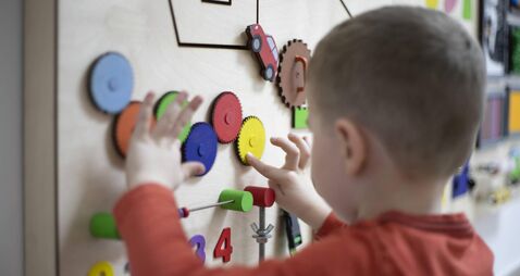 Boy playing with the interactive board